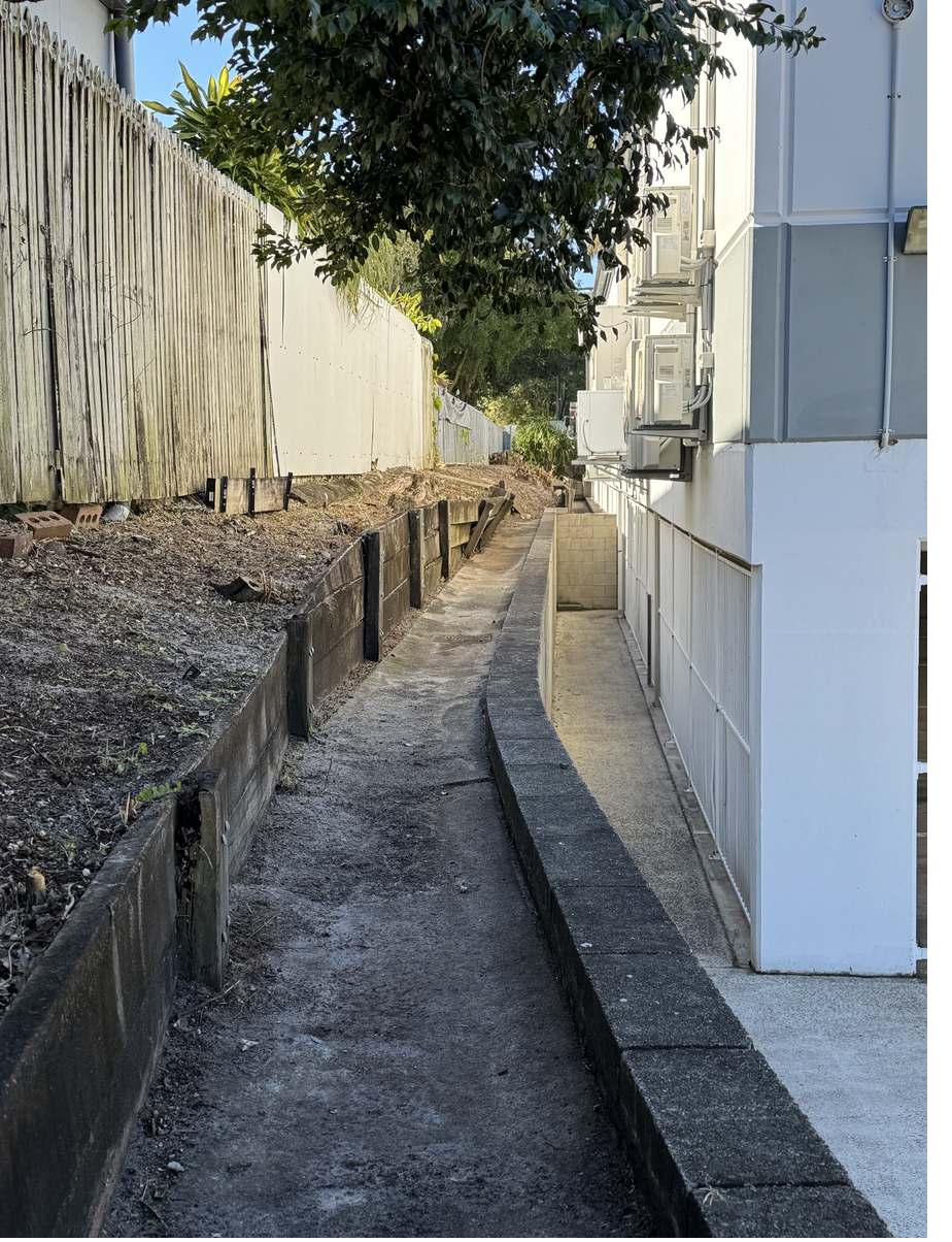 Service lane bed cleared of overgrowth with the walkway reopened, Mooloolaba