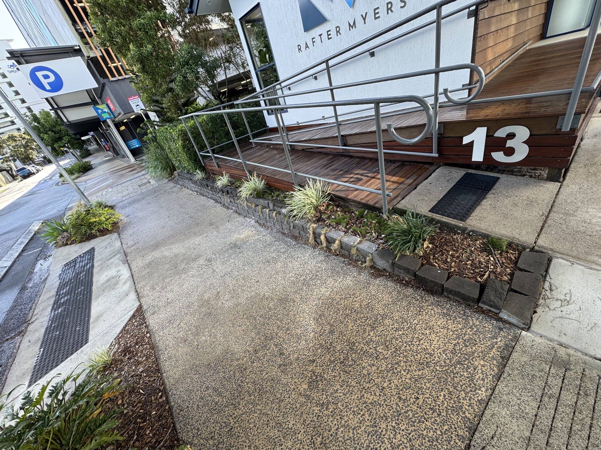 Entry path and garden beds at a commercial premises